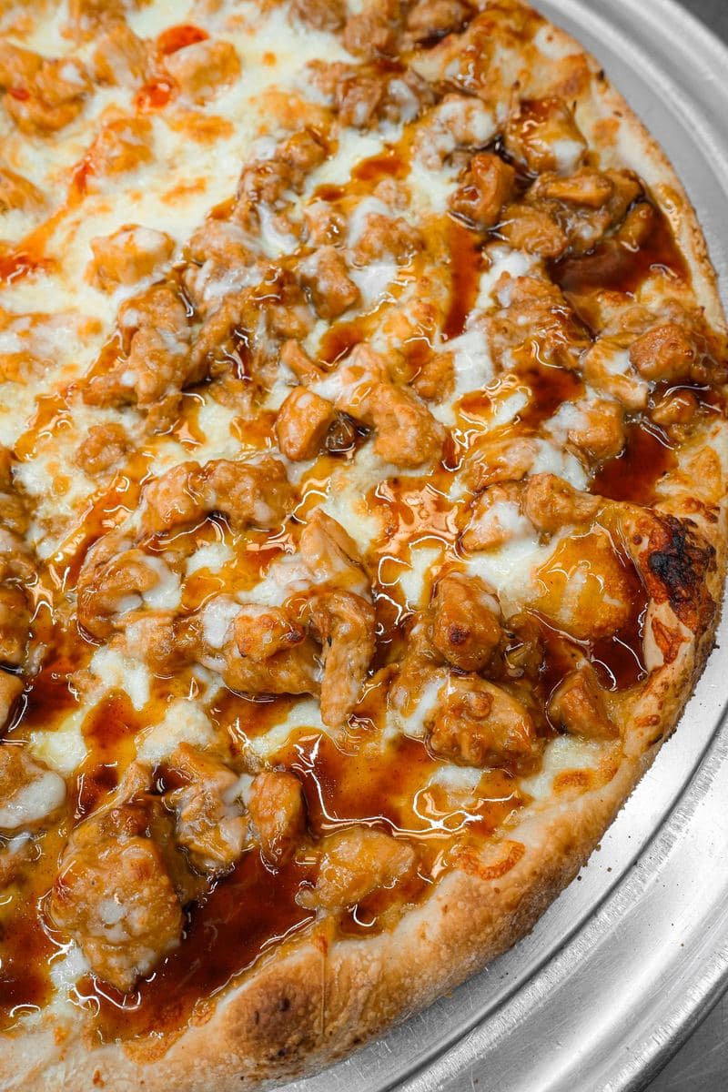BBQ chicken pizza topped with chicken cutlet in hickory-smoked barbecue sauce