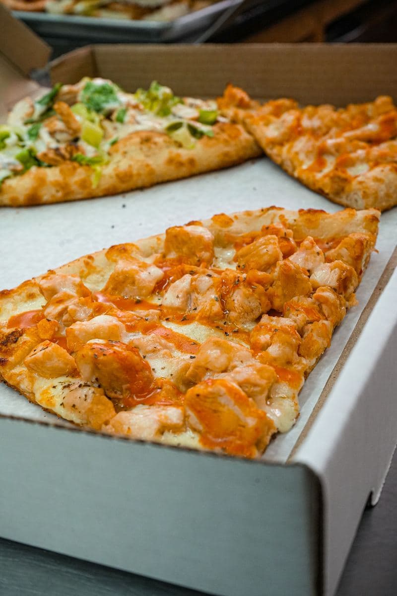 Buffalo chicken slice with ranch, cut from a full pie