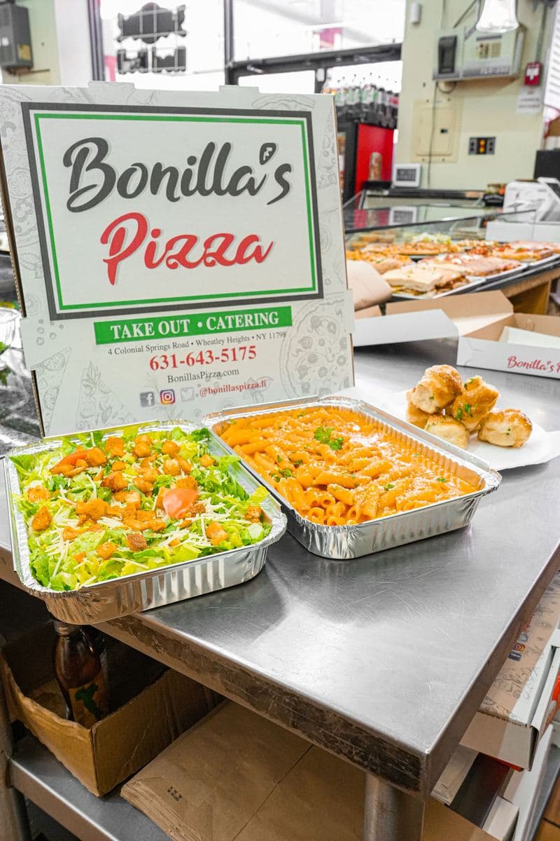 Catering trays set out on the counter at Bonilla's