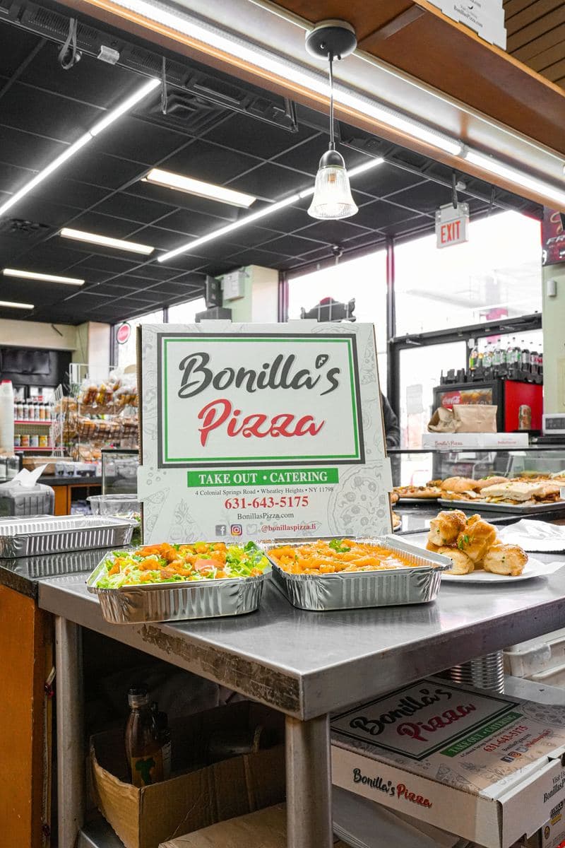 Catering spread on the counter with the Bonilla's shop floor behind