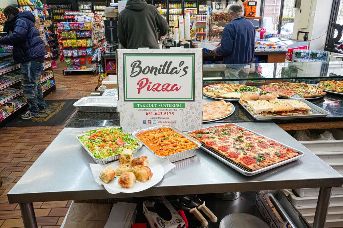 Catering spread at the front counter with the store behind