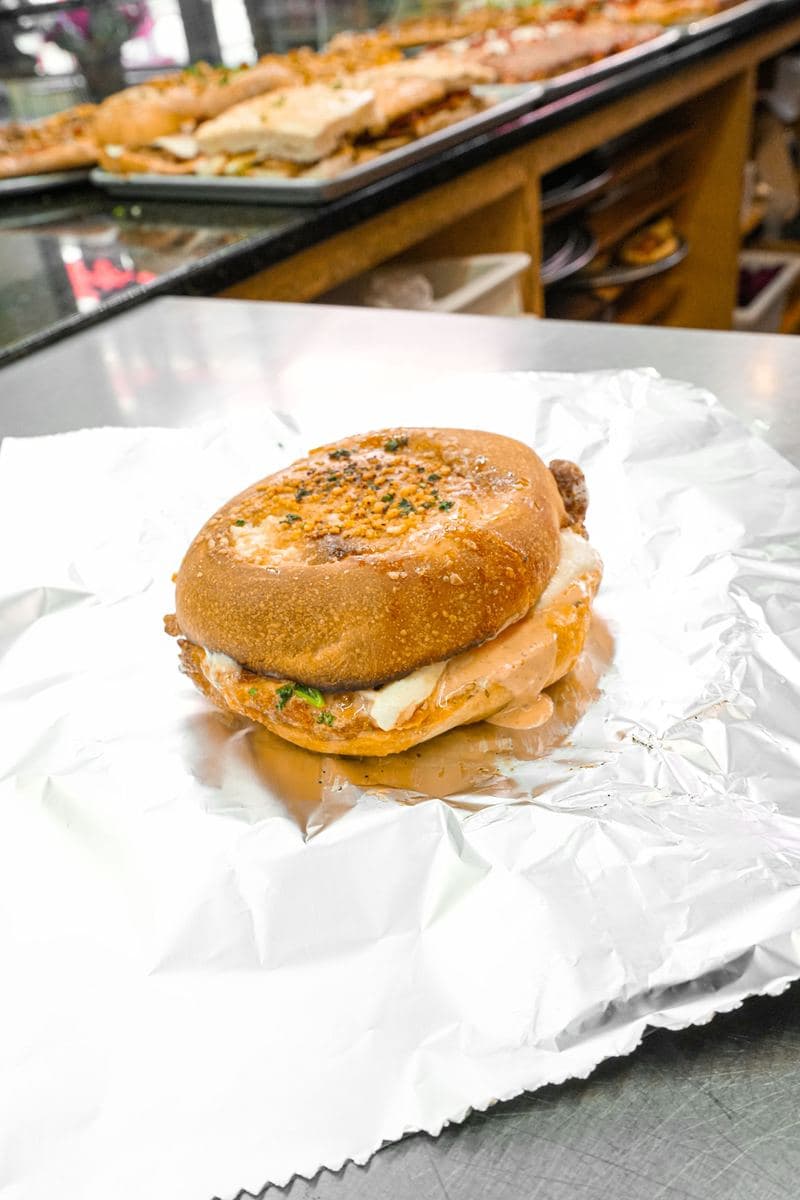 Chicken cutlet sandwich on a roll, wrapped on foil