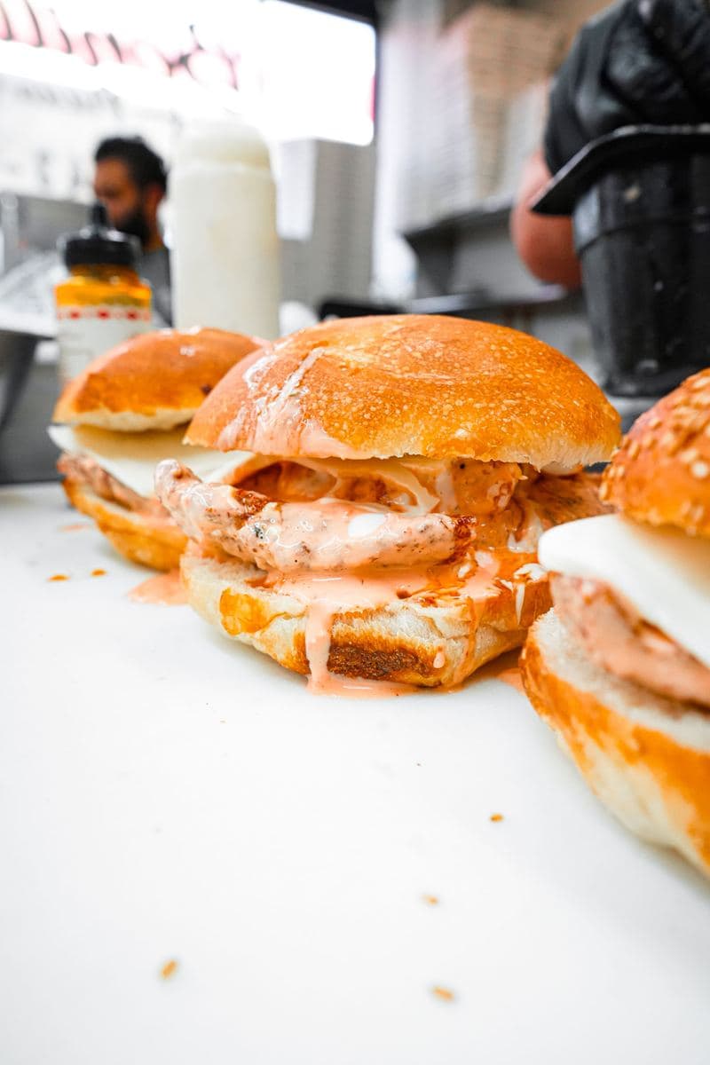 Chicken cutlet sandwich closed on a sesame roll