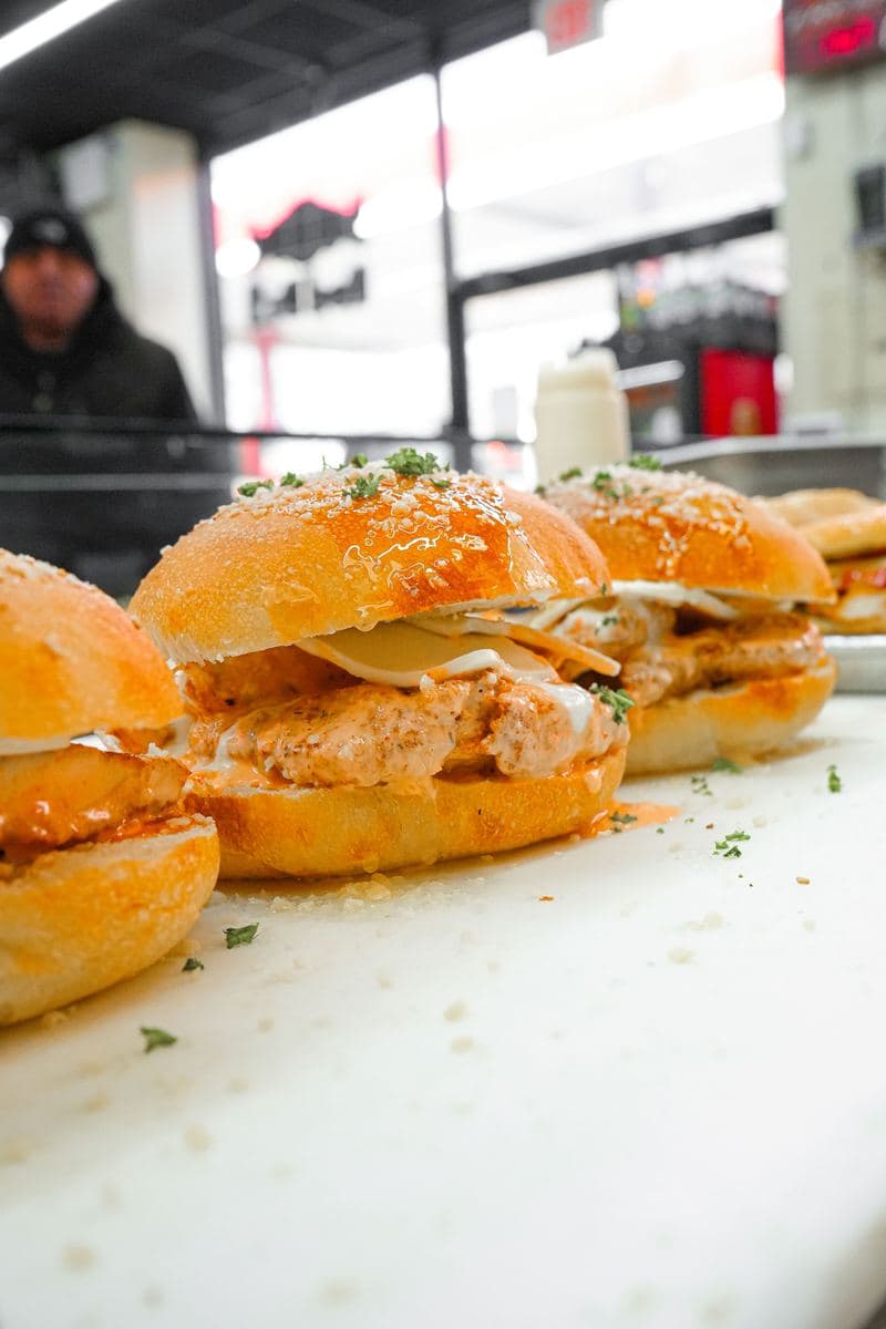 Chicken cutlet sandwiches on rolls, finished with parsley