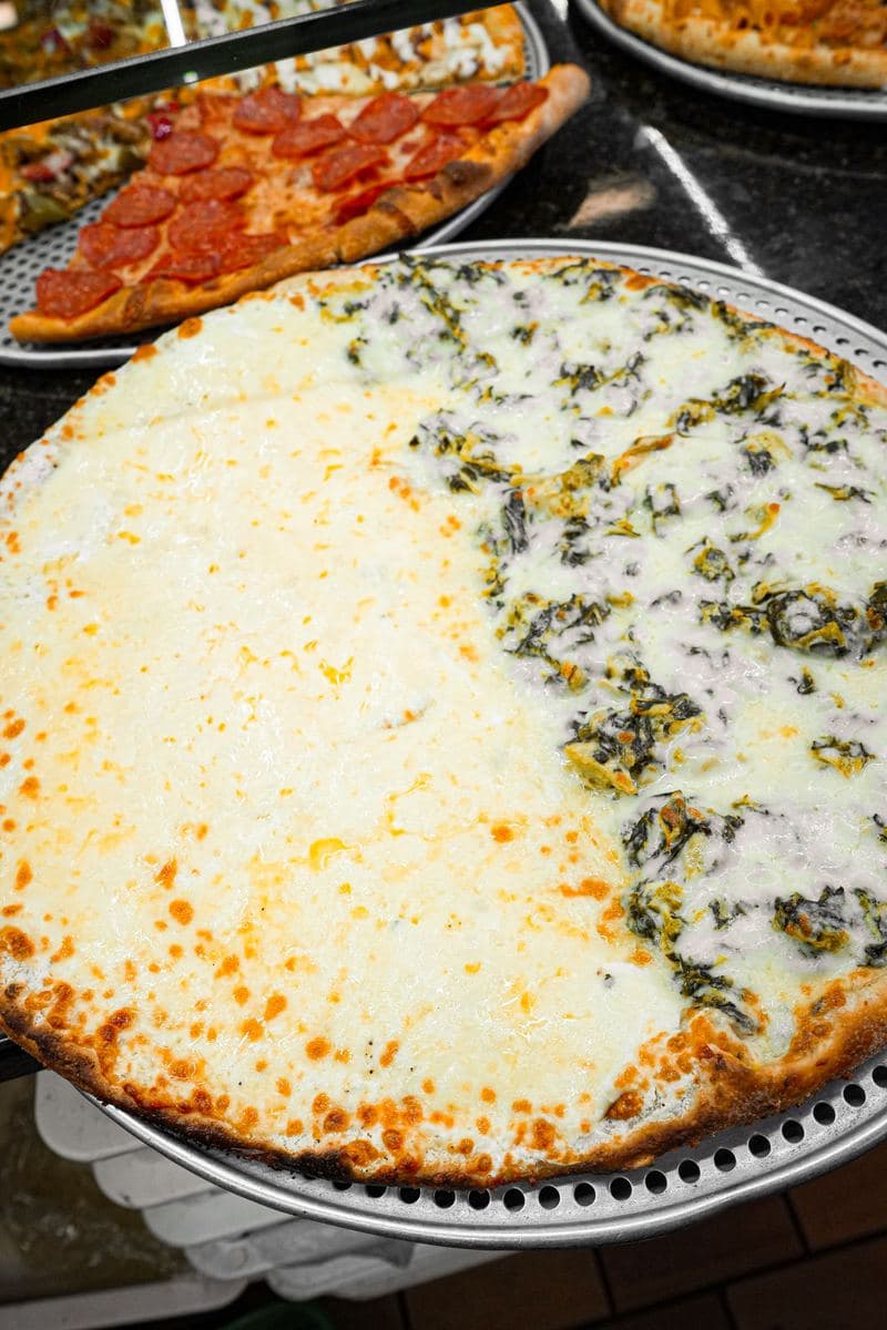 Round pie split half plain white, half spinach and ricotta
