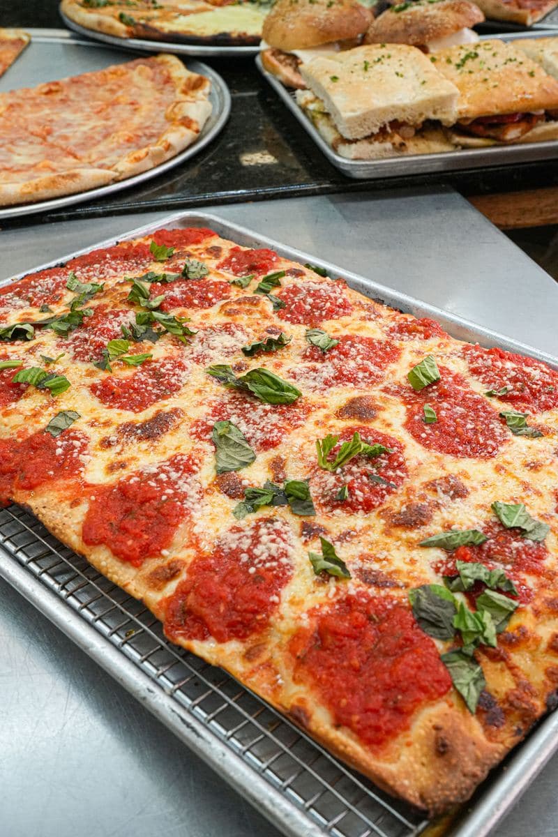 Margherita Sicilian tray topped with crushed tomato, parmesan and basil