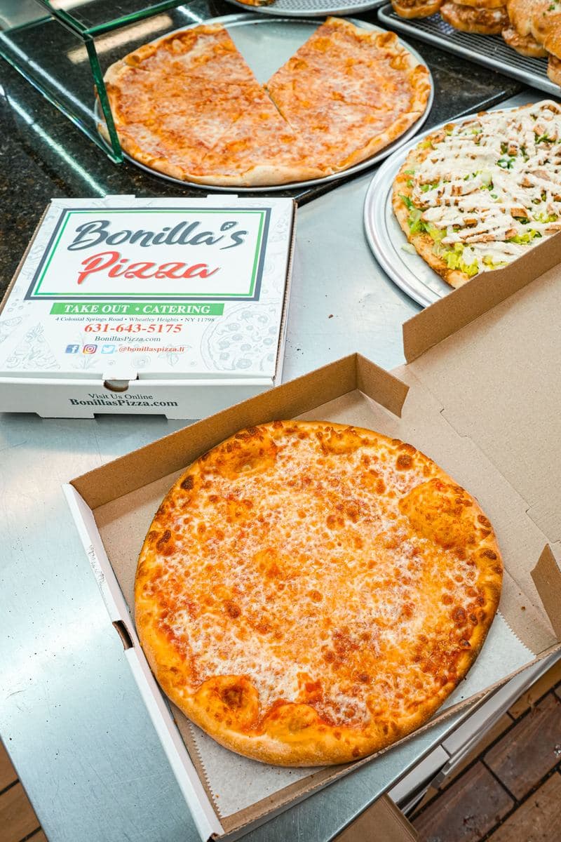 Personal cheese pie in an open Bonilla's box