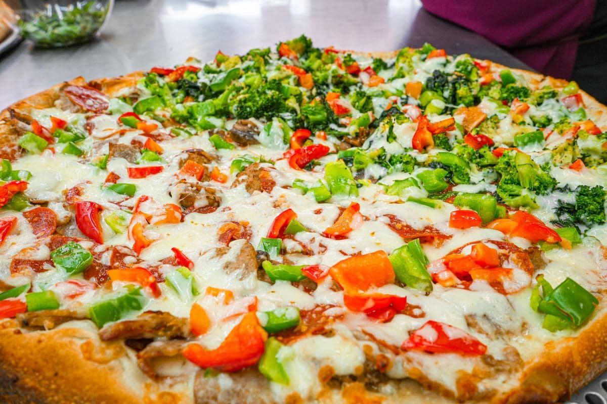 Vegetable pie loaded with broccoli, peppers and mushrooms