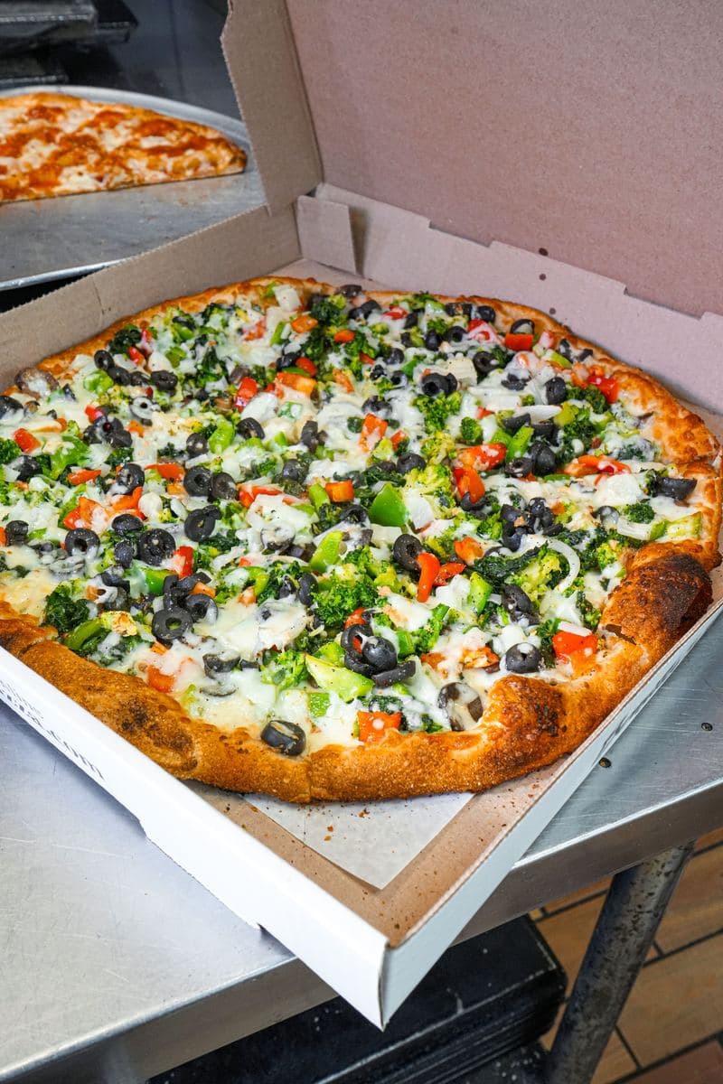 Vegetable pie in an open Bonilla's takeout box