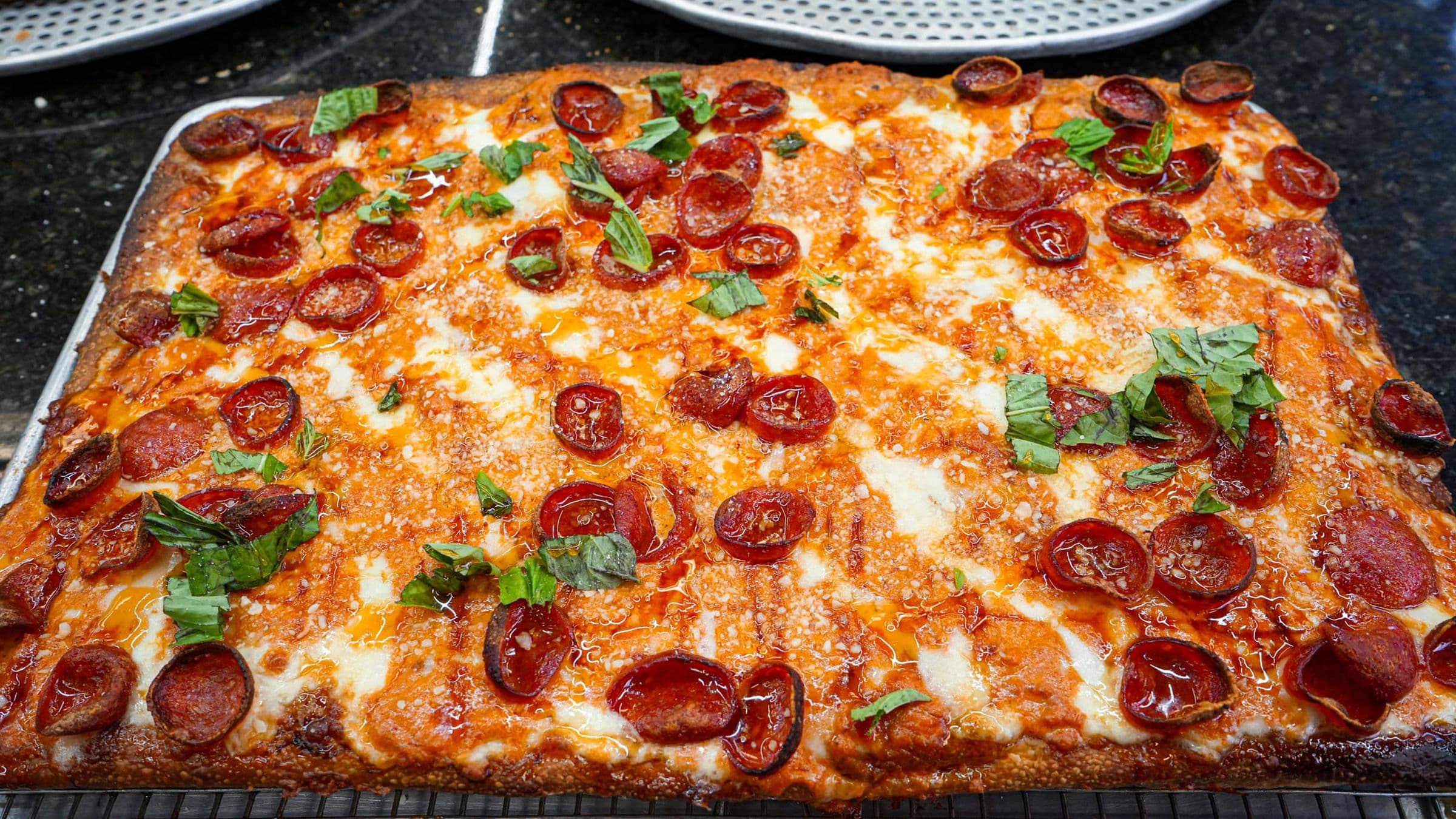 Pepperoni Sicilian finished with fresh basil